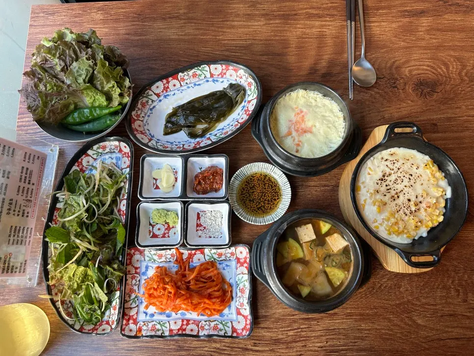 A table generously filled with basic side dishes