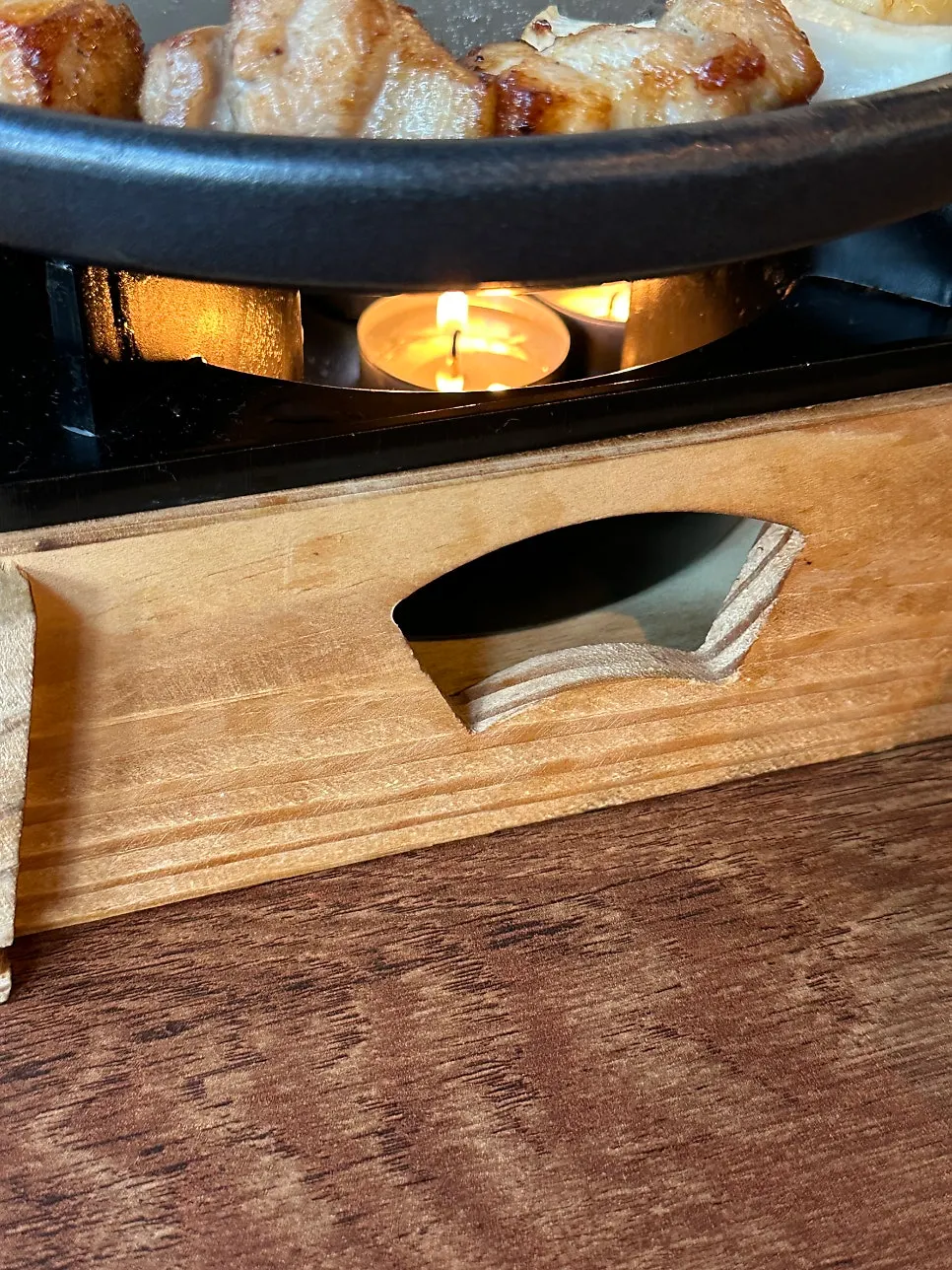 Meat plate placed on a candle warmer