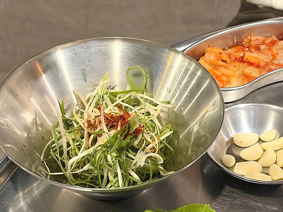 Side dishes including kimchi and salted hairtail fish sauce