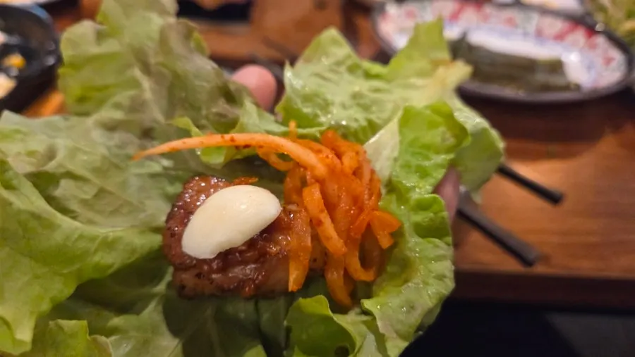 A group seated around the table at the meat restaurant