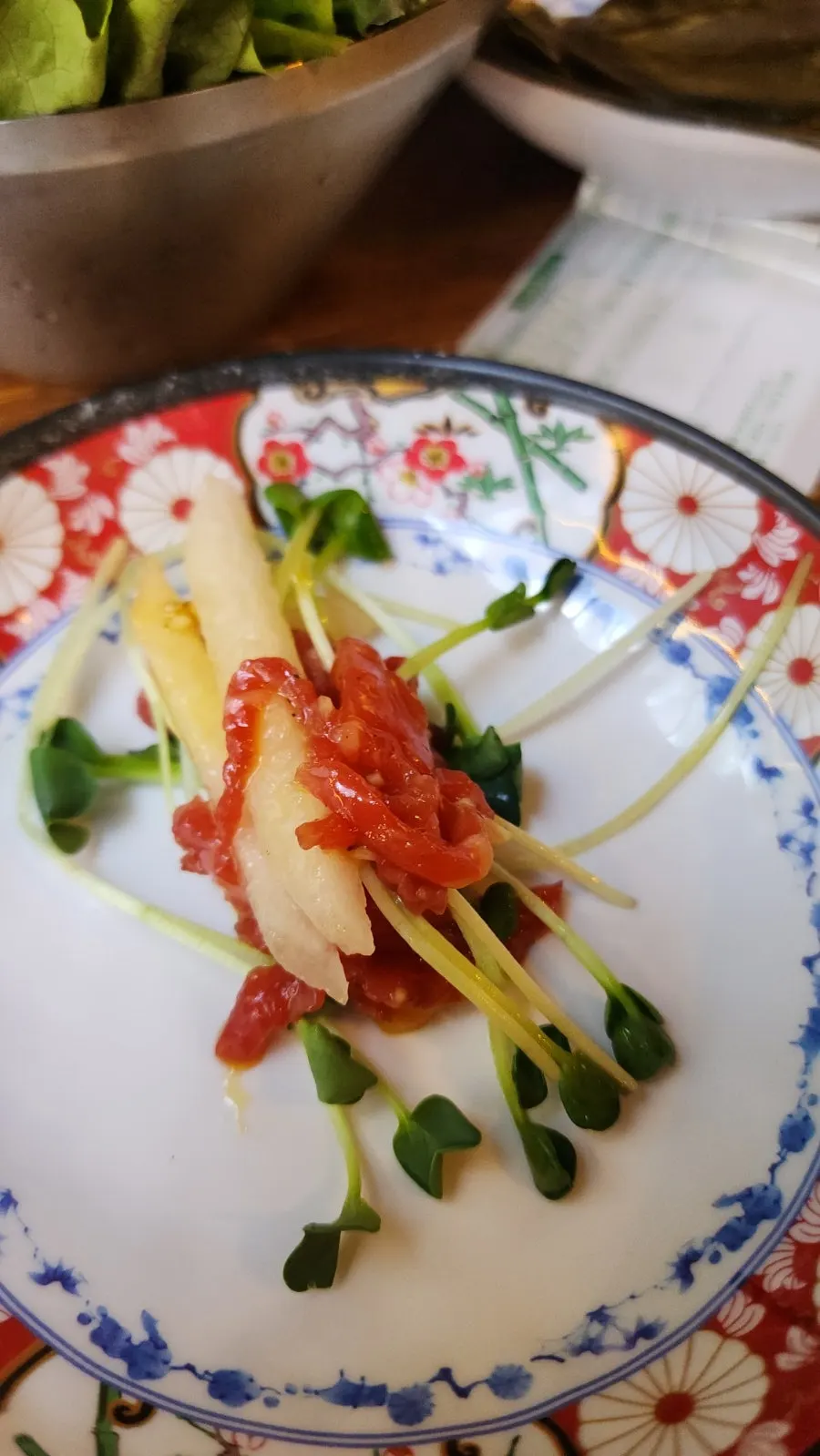 Plate of complimentary beef tartare at Baekseok Kkogijip