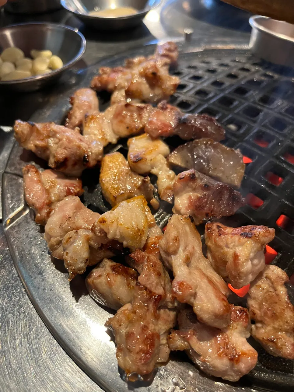 Specialty pork cuts cooking on the grill