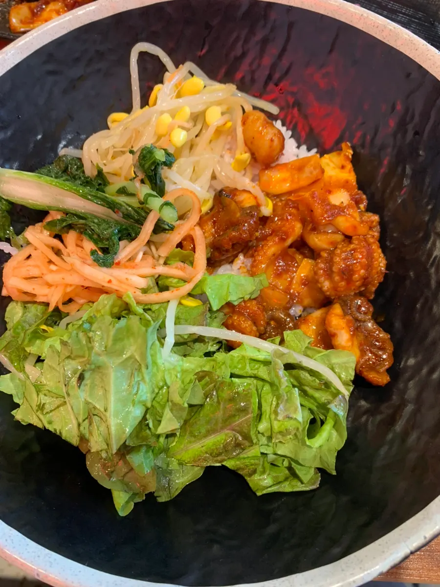 Jjukkumi rice mixed with vegetables and radish salad