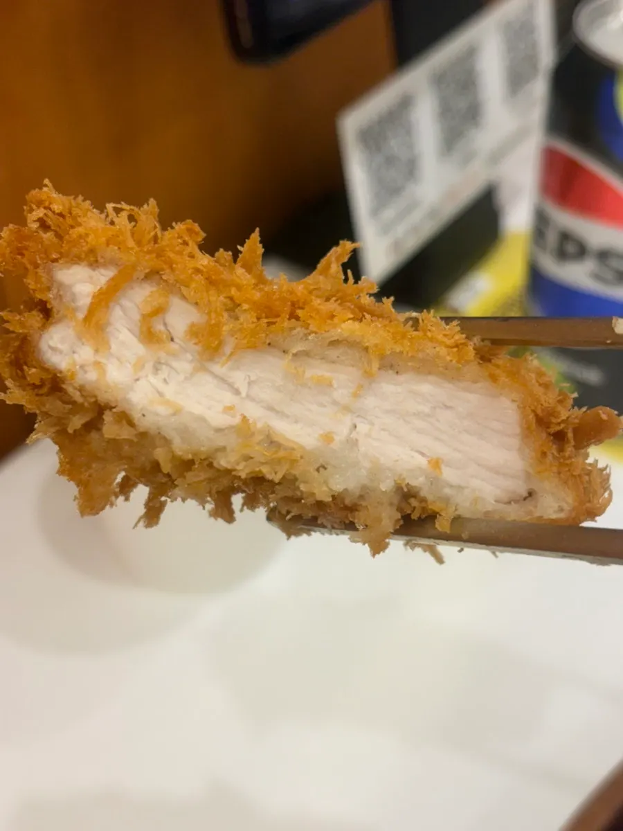 Cross-section of tonkatsu showing crispy breading