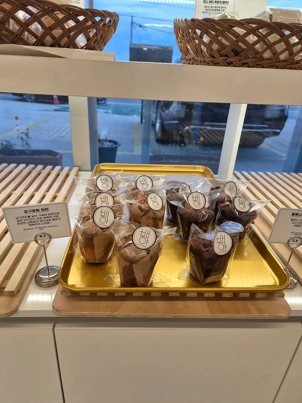 The bread display window at Baegya Coffee that opens with a button