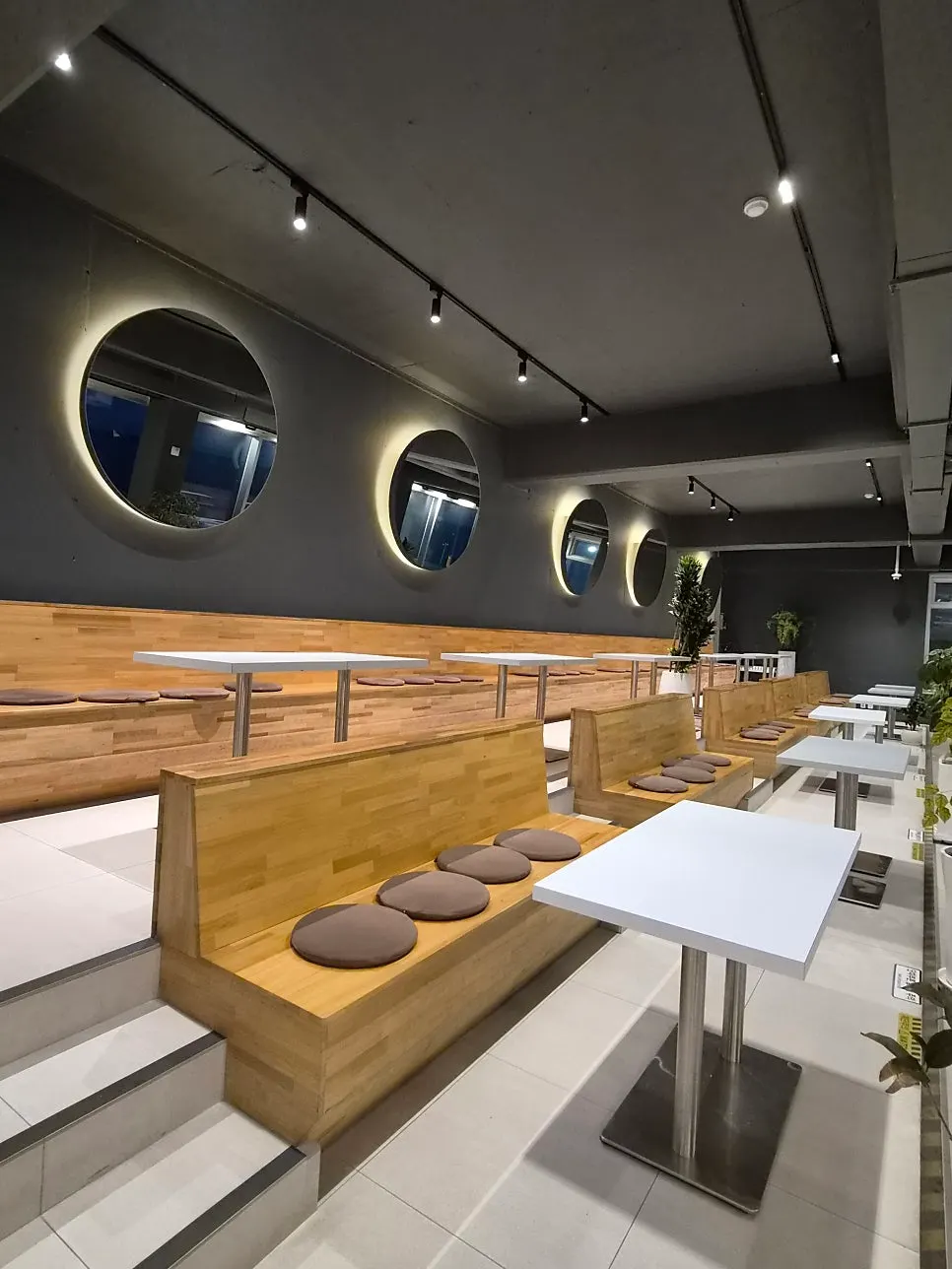 Sea view through the floor-to-ceiling windows on the 2nd floor of Baegya Coffee