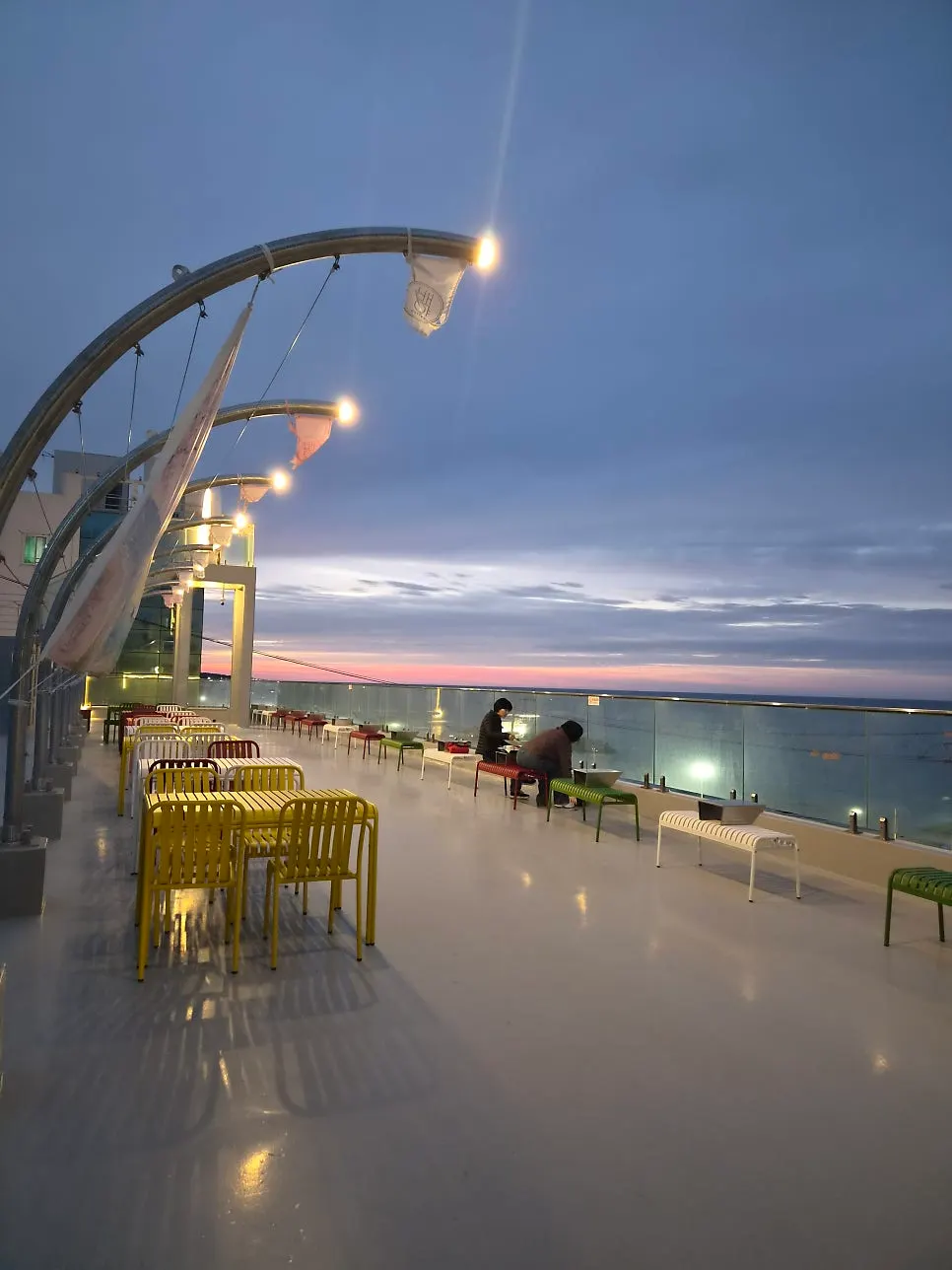 Sunset over the sea seen from the terrace at Baegya Coffee