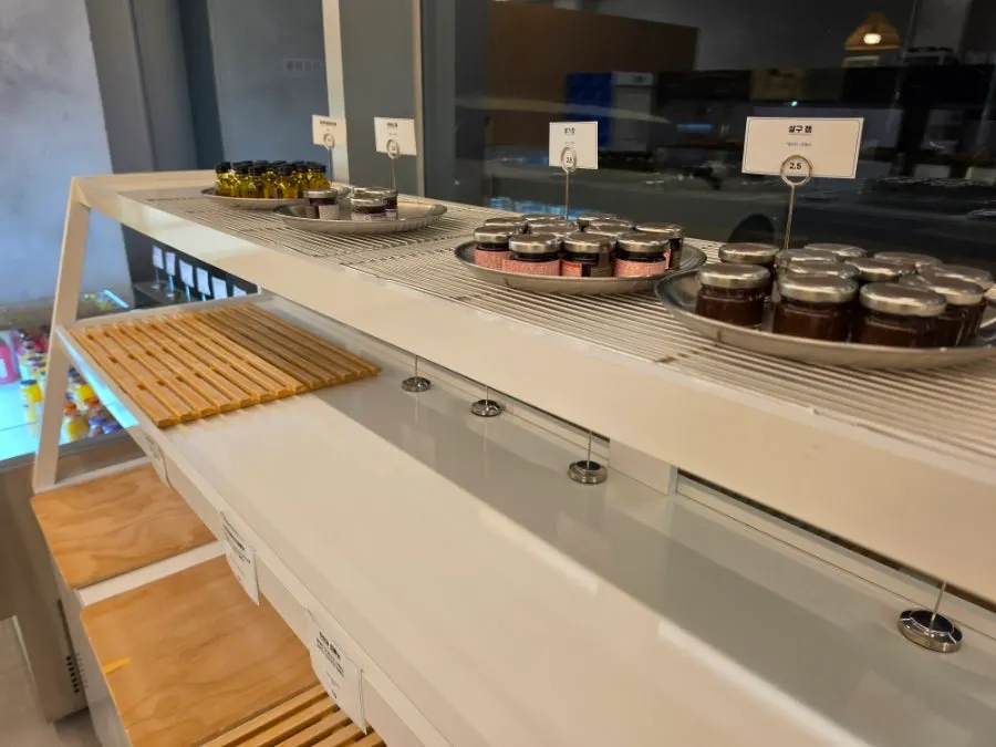 Bakery display case with little bread left late in the day