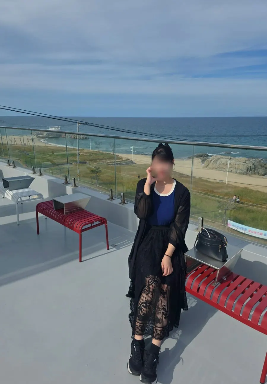 Rooftop railing and sea view at Baegya Coffee
