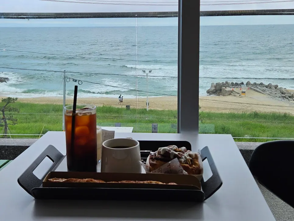Drinks and bread set against the sea view