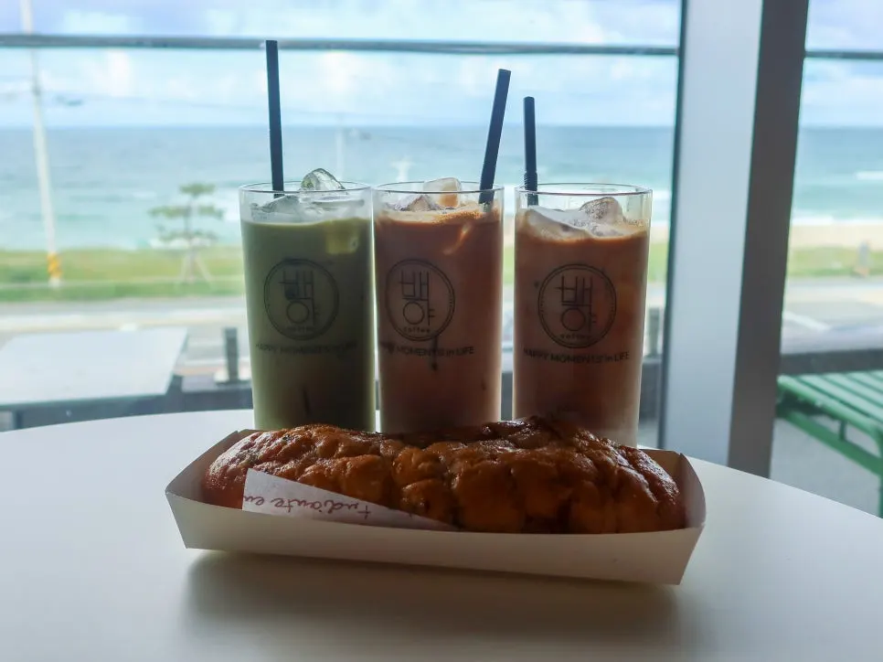 A table at Baegya Coffee with drinks and the garlic baguette