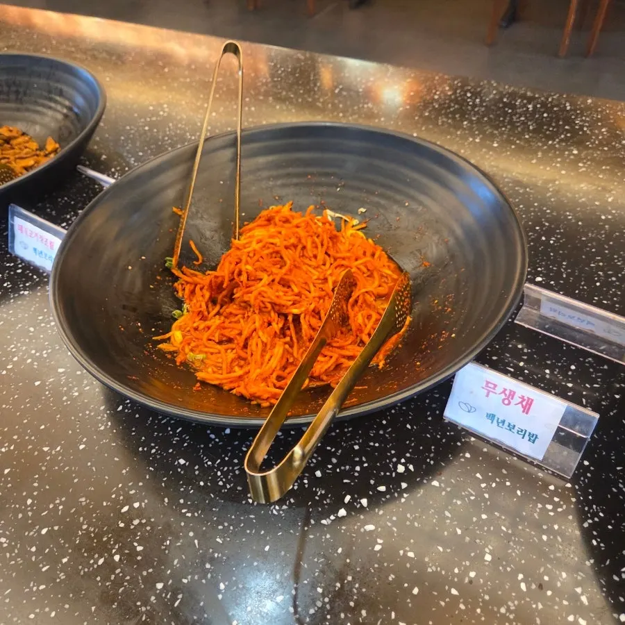 Japchae and other banchan at the self-serve bar