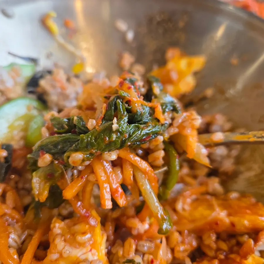 Barley bibimbap mixed with sesame oil and gochujang