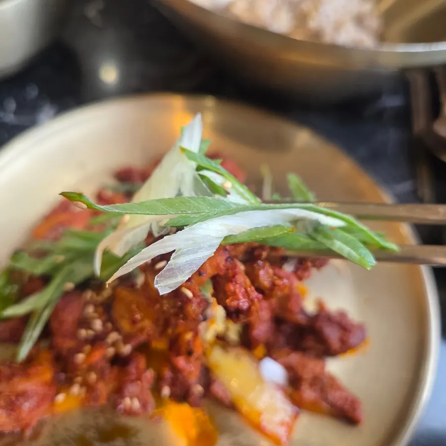 Sweet and spicy pork bulgogi topped with scallion shreds