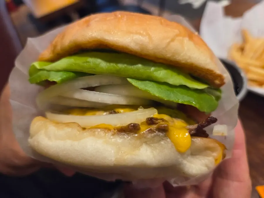 Cross-section of the Bas Burger showing soft bun and beef patty