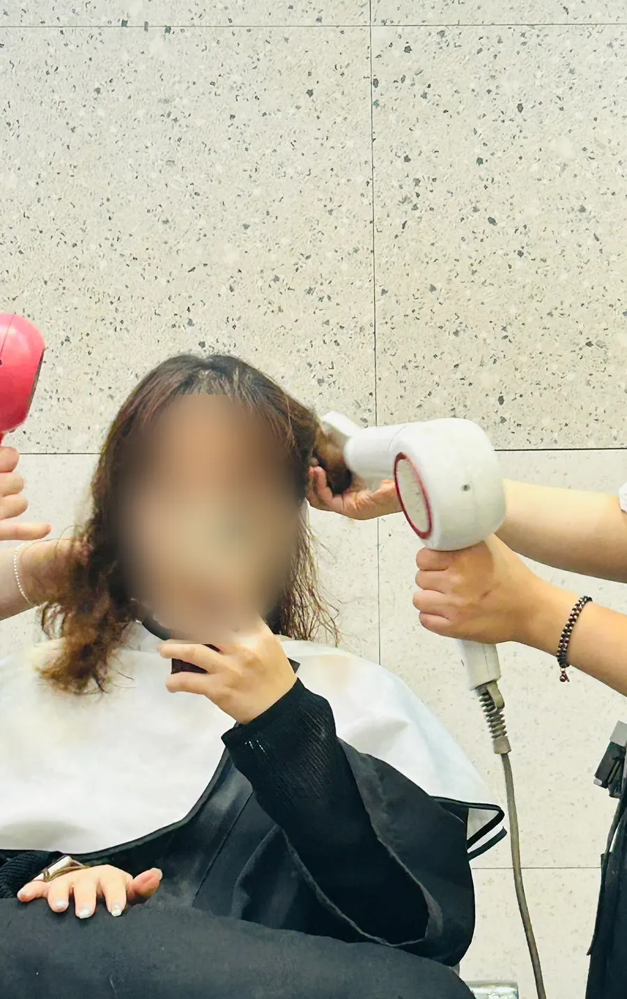 Straightening press work on the top section of hair