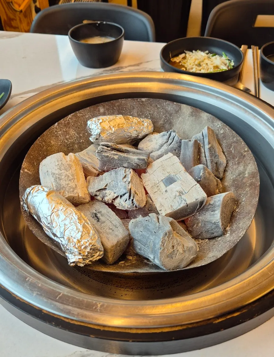 Charcoal brazier brought to the table