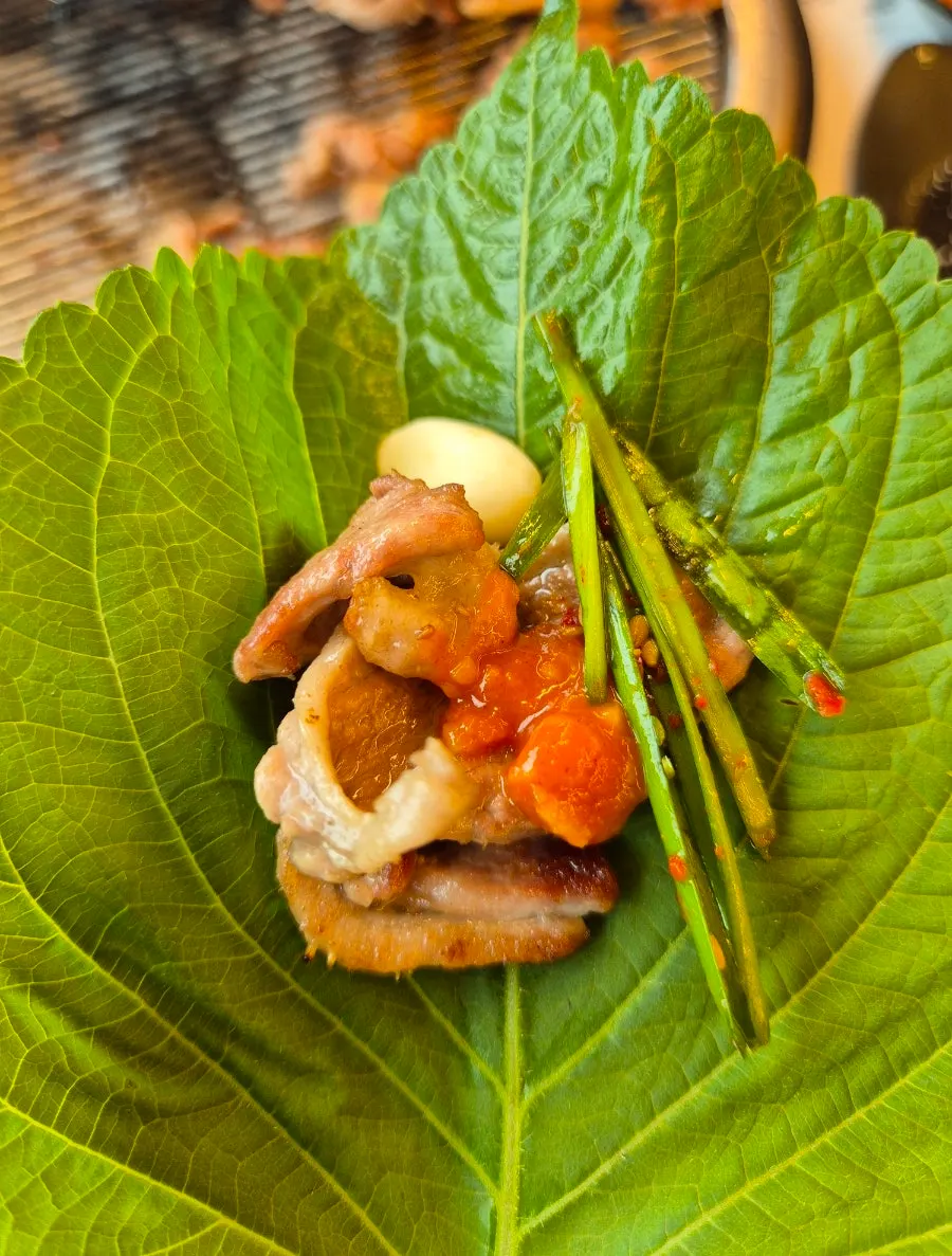 Perilla leaf wrap with duck and chives