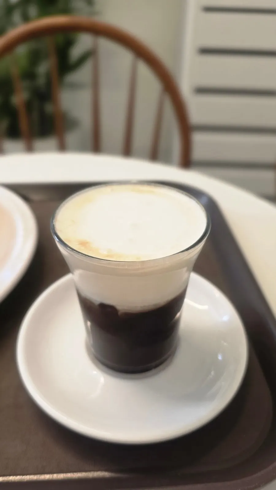 Vertical shot of salted cream latte and dessert