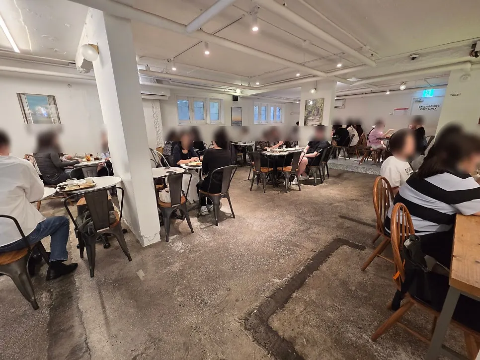 High-ceilinged basement seating at Bakerist Brown