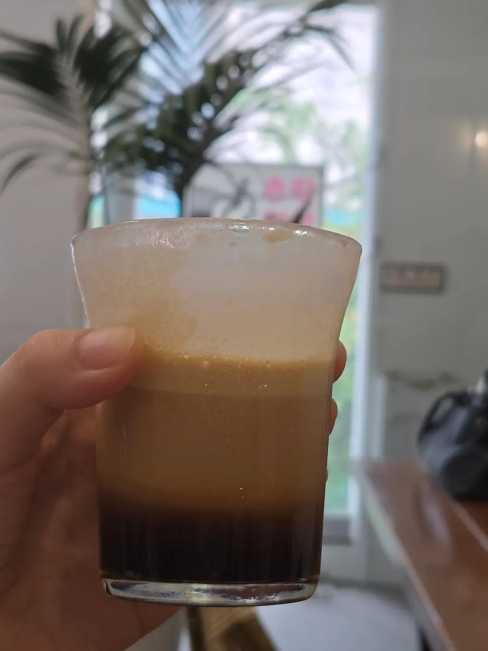 Salted cream coffee next to a hot americano