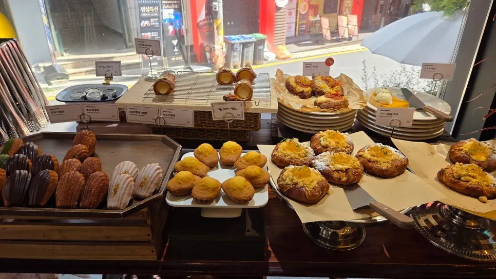 First-floor shop with customers coming and going to pick up bread