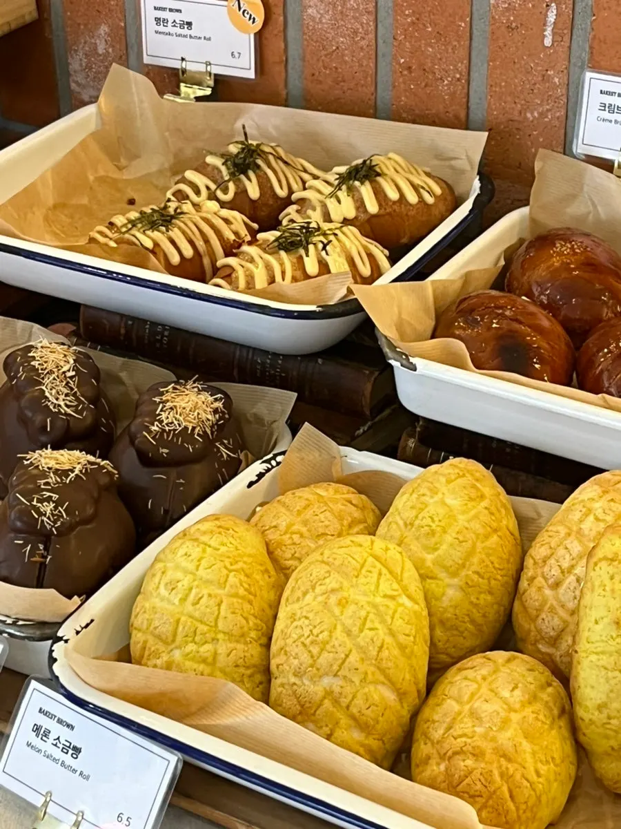 Dessert display with madeleines and egg tarts
