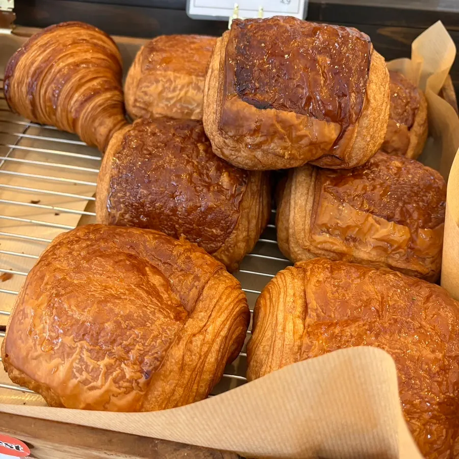 Croissants and pain au chocolat pastries on display