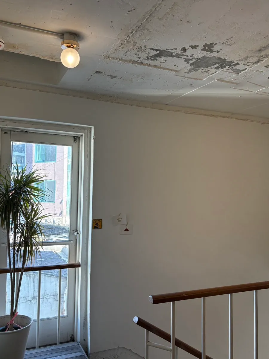 High ceiling on the 3rd floor with a gable roof and pendant lights