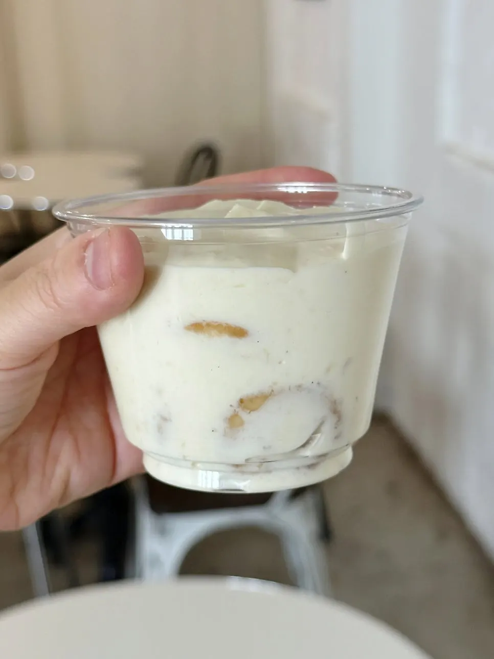 Banana pudding topped with a pretzel