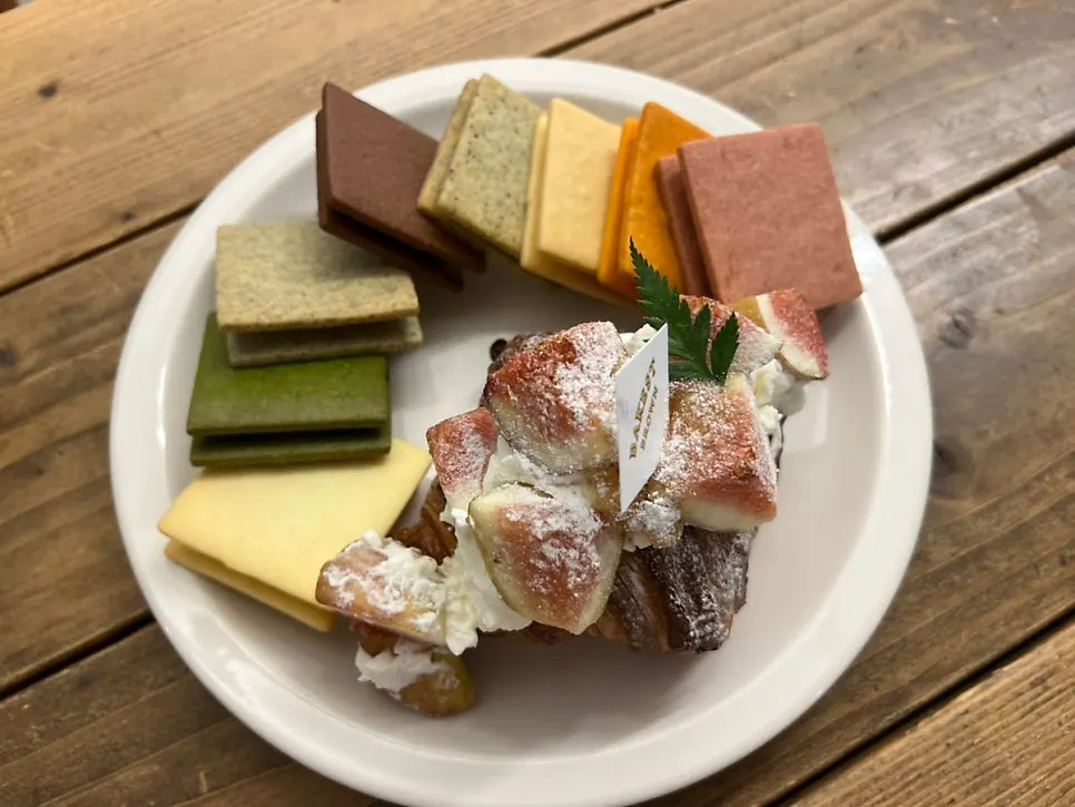 Table setting with salt cream coffee, fig croissant, and Gangnam Sand set