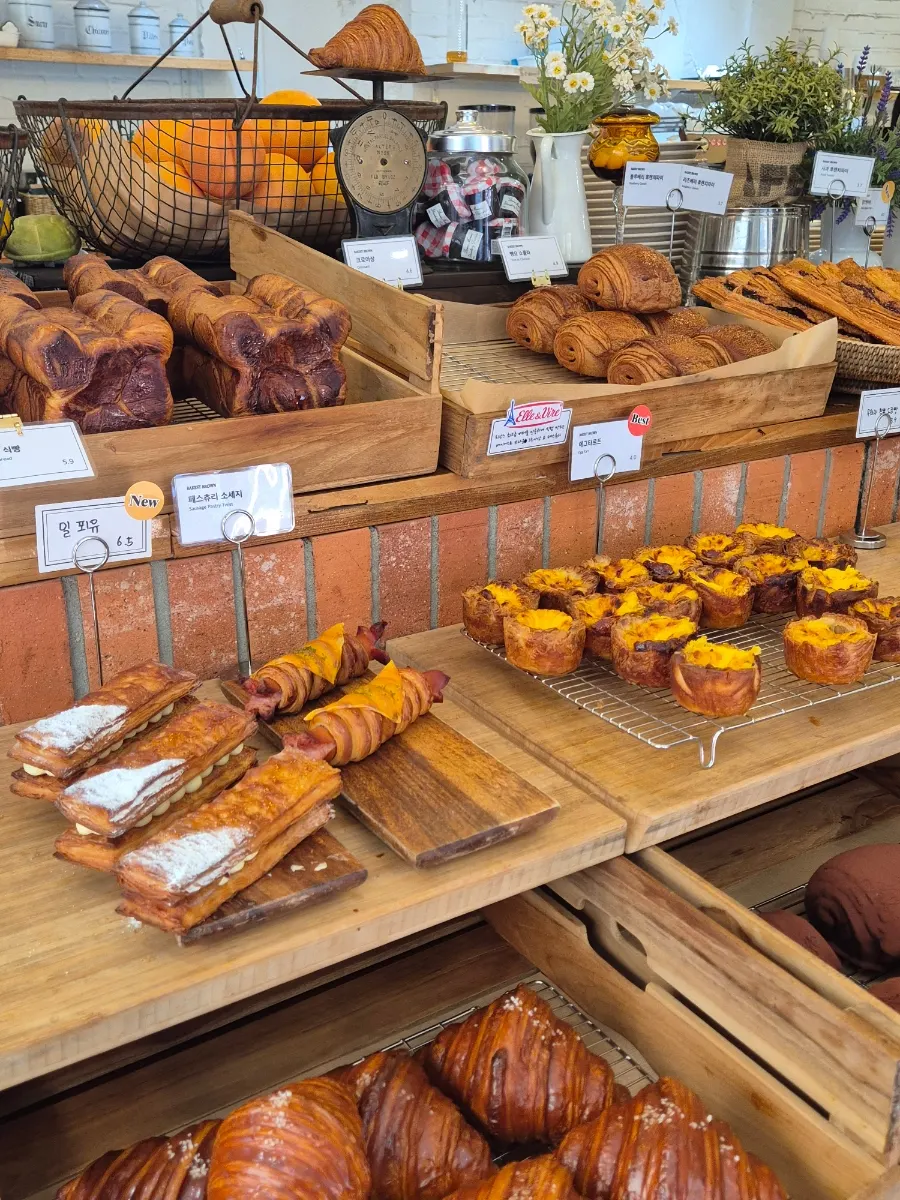 Full view of the counter lined with various breads