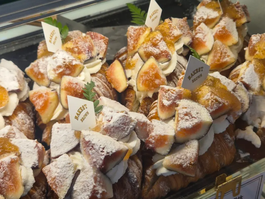 Quinoa amann desserts arranged inside the showcase