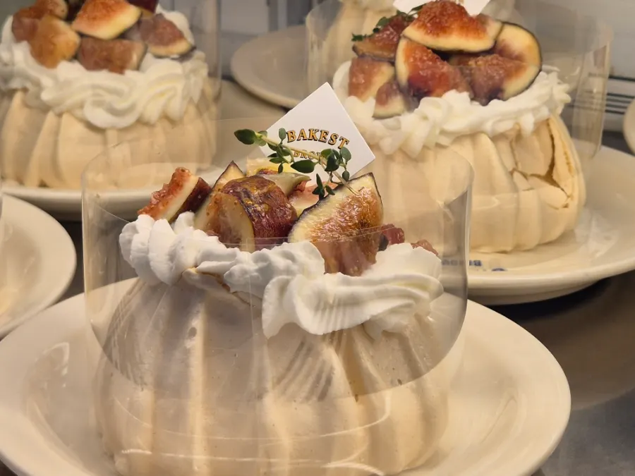 Showcase with fig croissant and fig pavlova