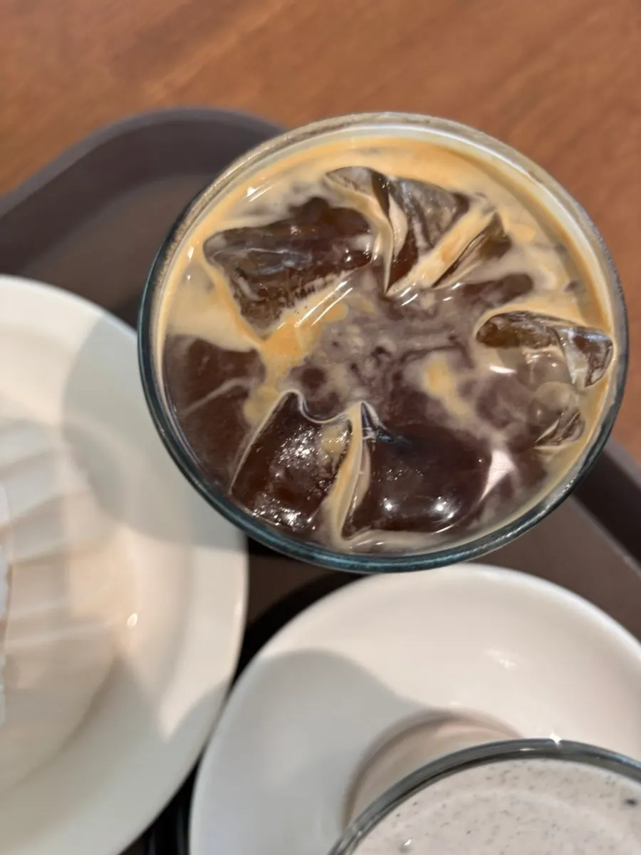 Iced americano next to the desserts