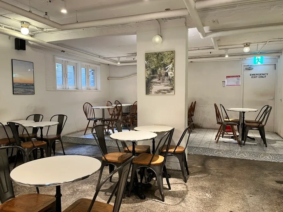Semi-basement seating right after opening, with few customers