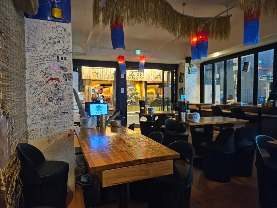 Dokmak-ro alley in Hapjeong lined with bars