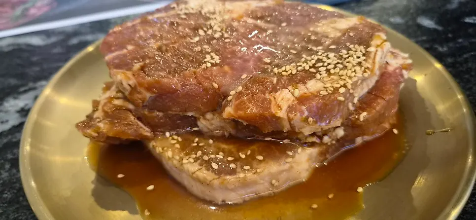 Plate of ribs soaked in marinade
