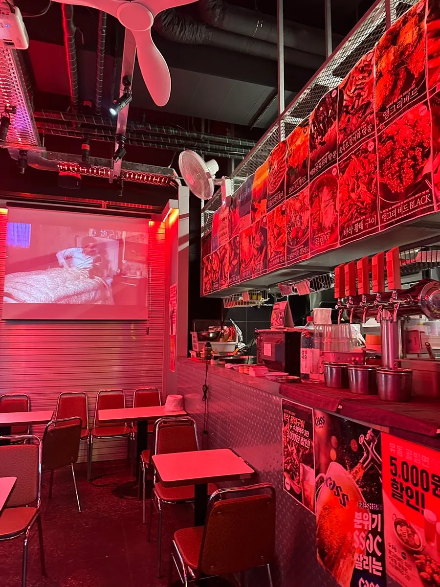 Red-toned interior with neon details
