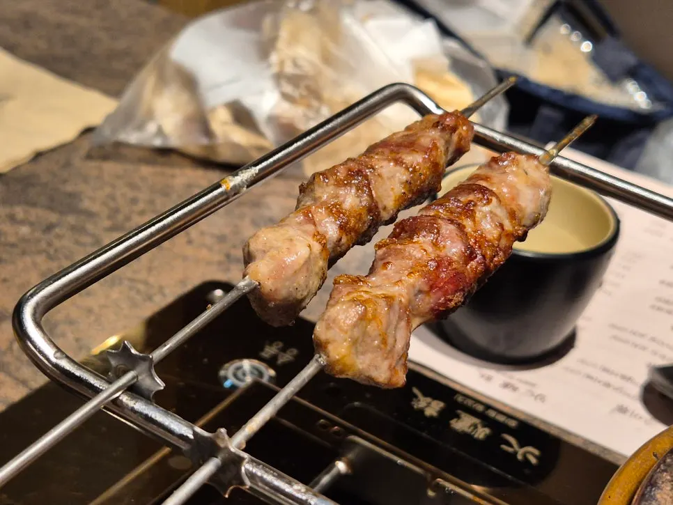Thick lamb skewers over a brazier