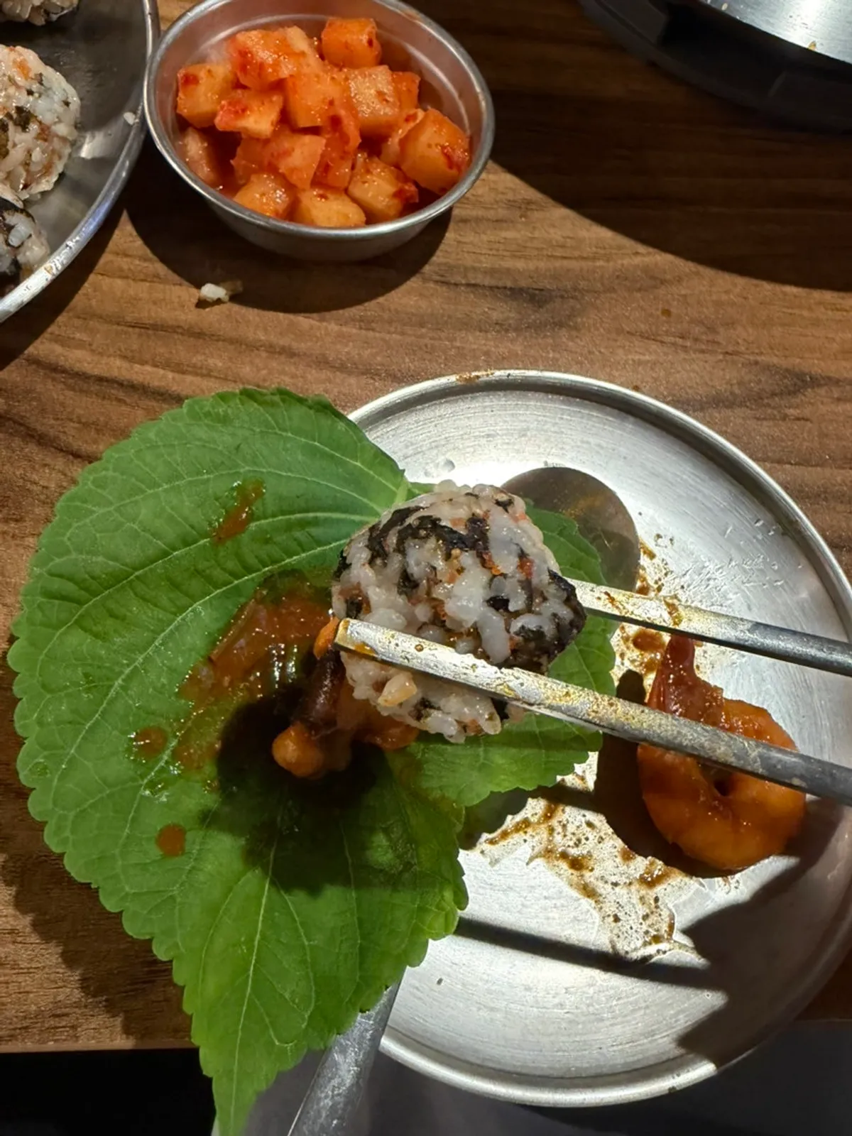 Nakgopsae wrap on a perilla leaf