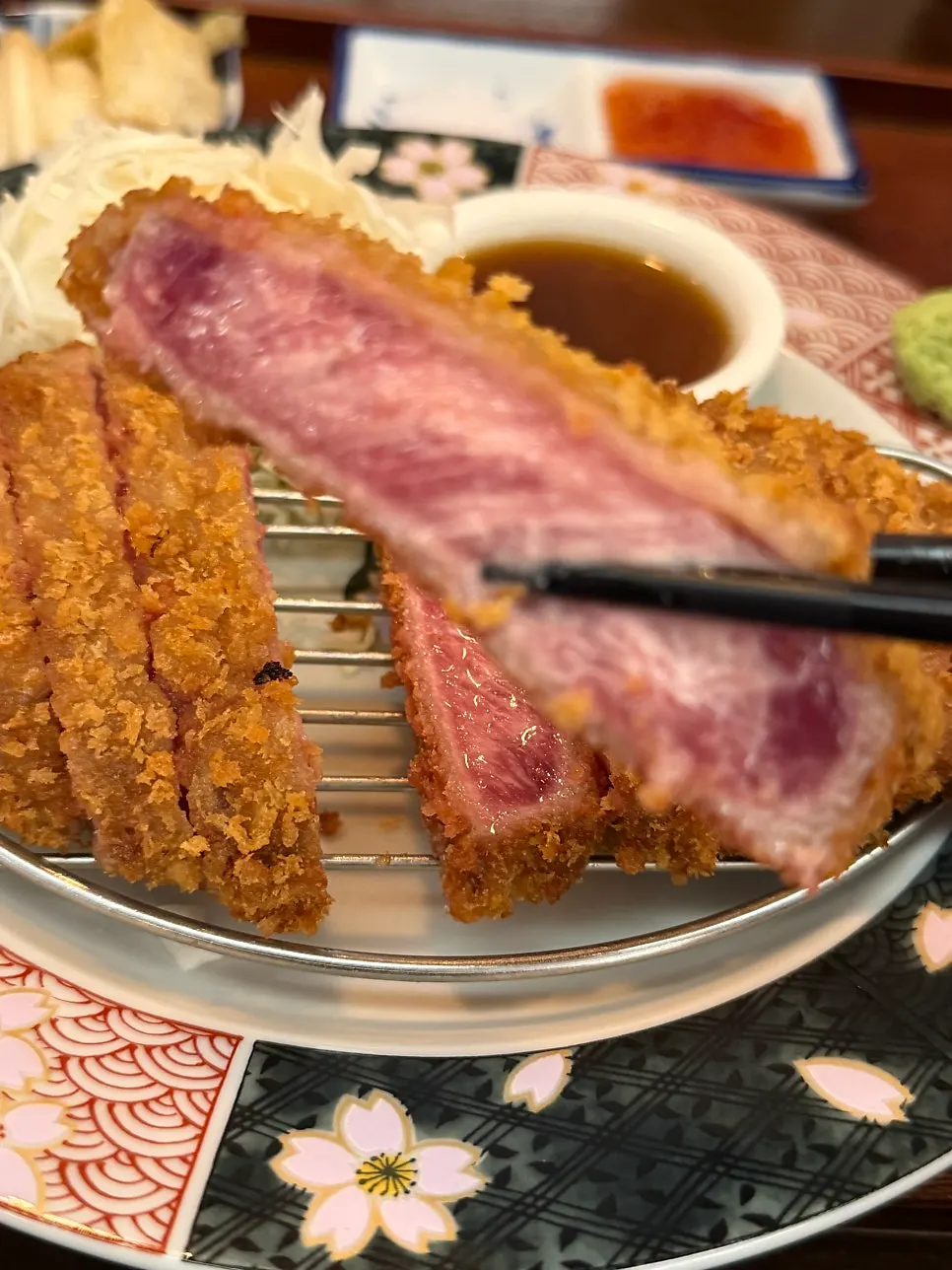 Sirloin gyukatsu grilling to a golden brown on the brazier