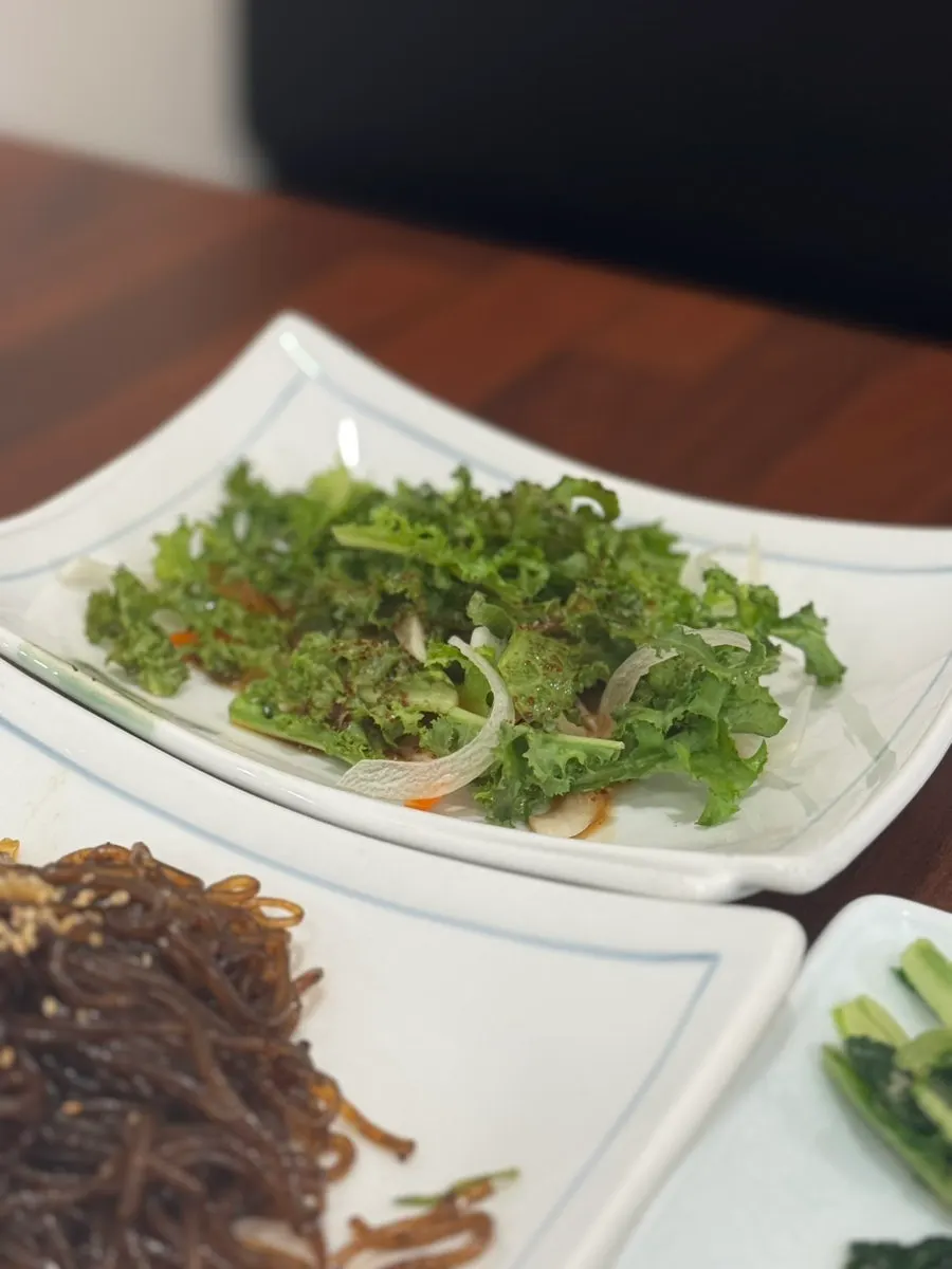 Japchae and assorted Korean side dishes