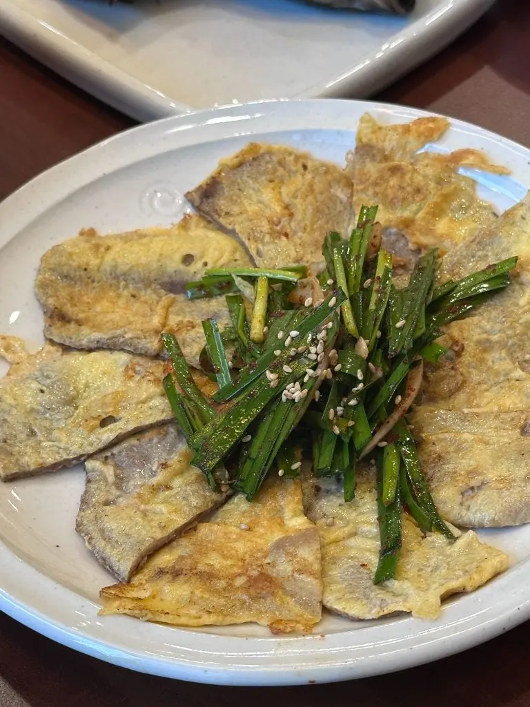 Yukjeon served with shredded scallions