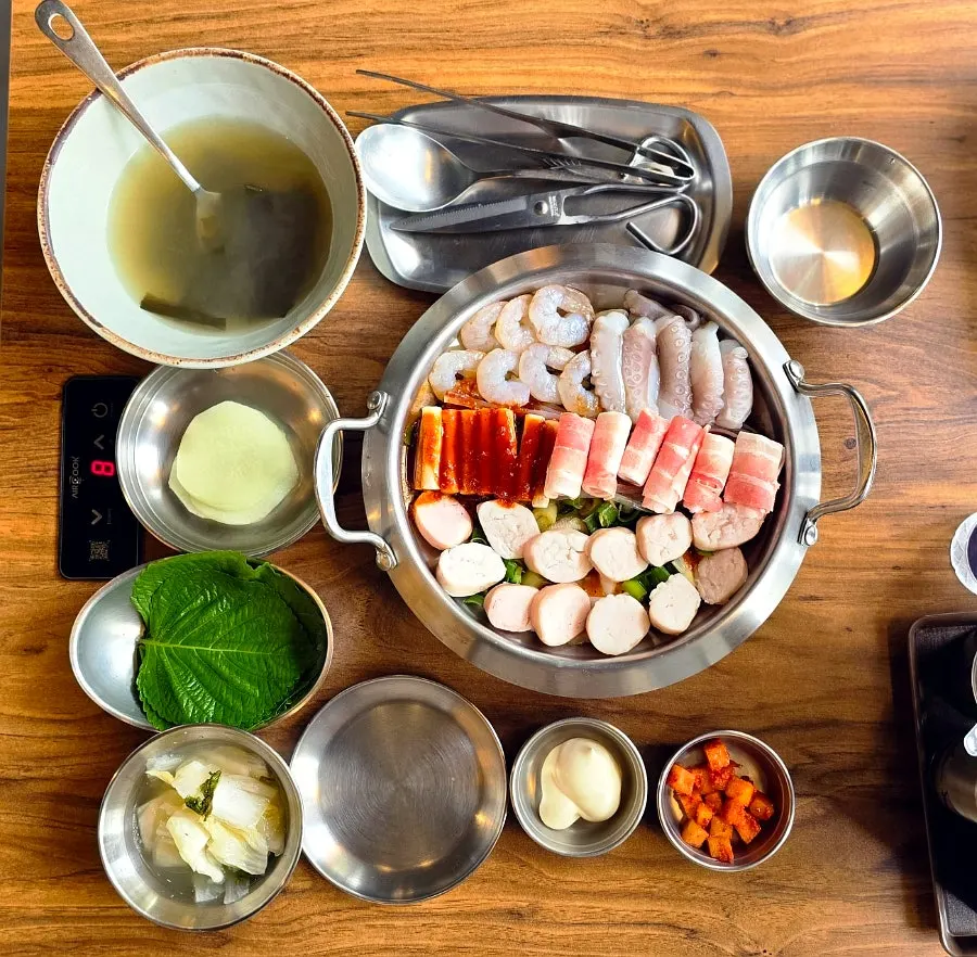 Menu listing nakgopsae, naksamsae, and beef tripe hot pot