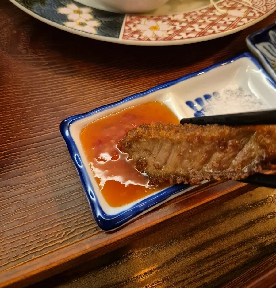 Grilling sirloin gyukatsu on the tabletop stove