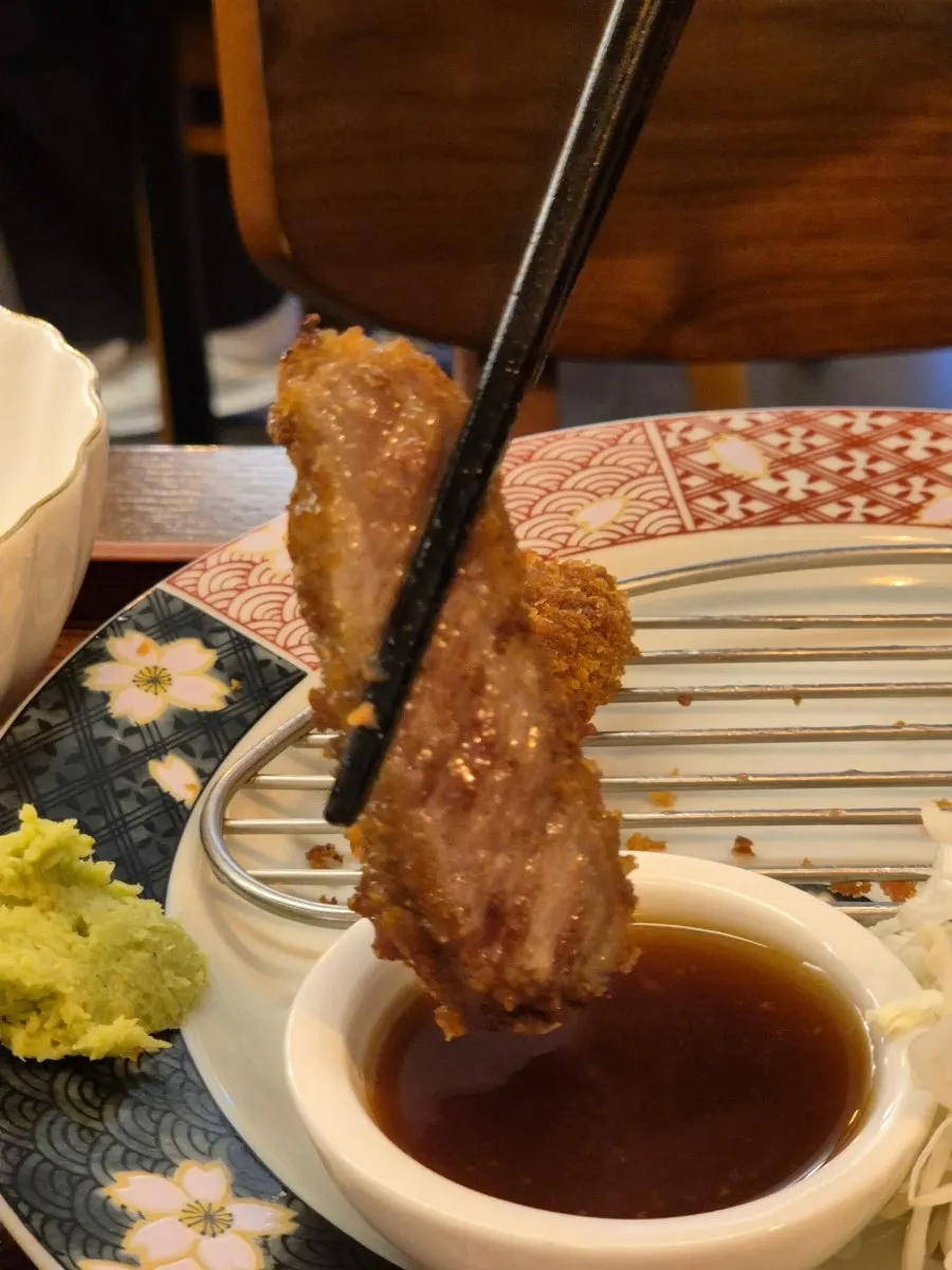 Grilled gyukatsu right before dipping into sauce