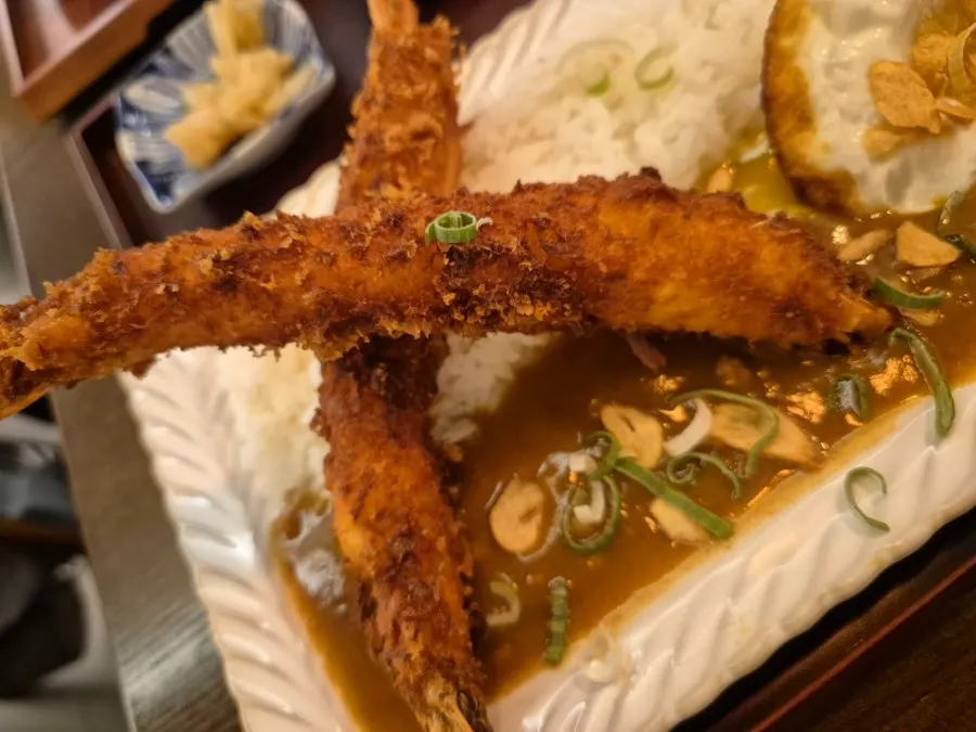 Japanese curry topped with two king shrimp tempura