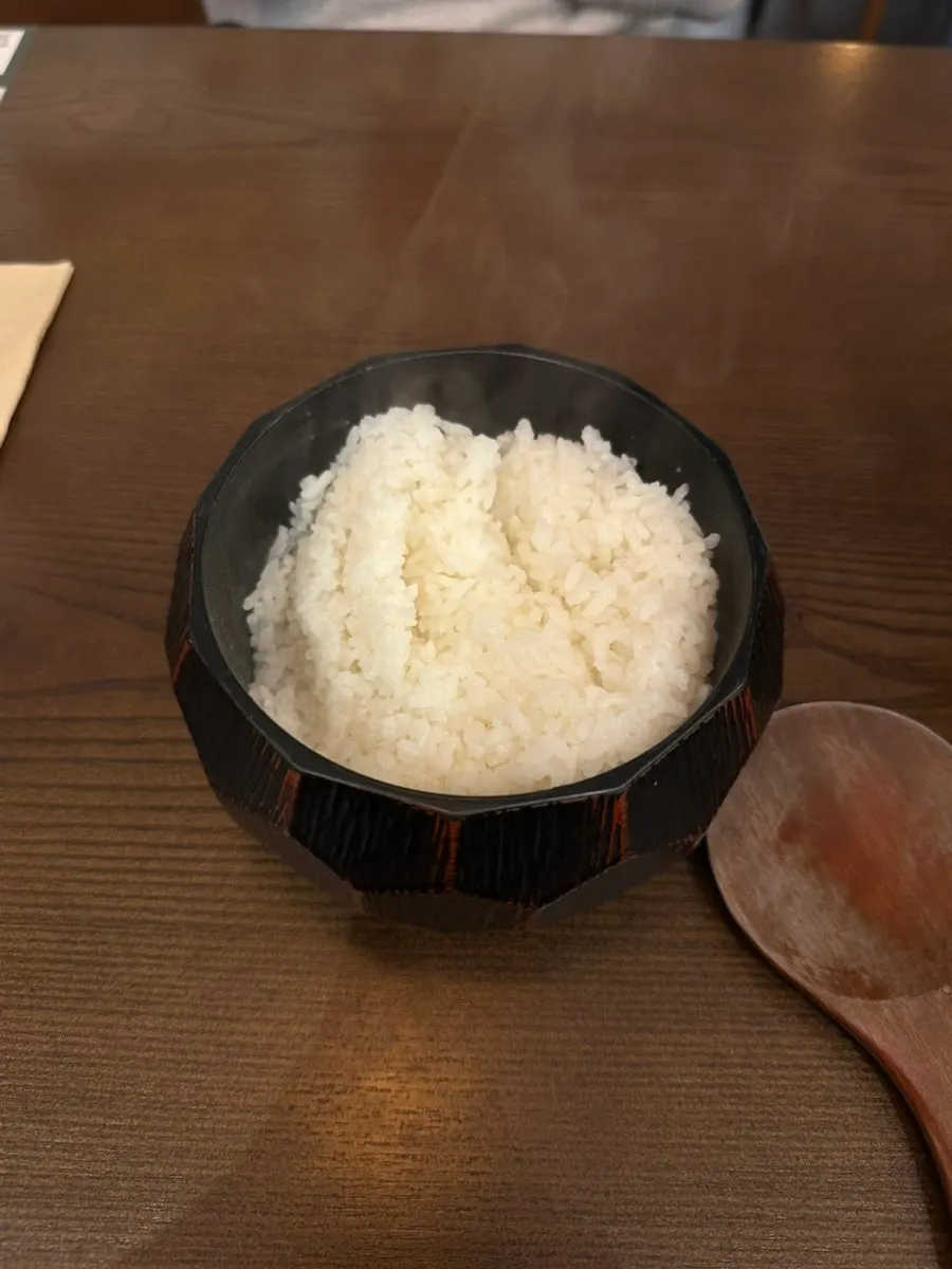 Scooping rice out of the rice pot