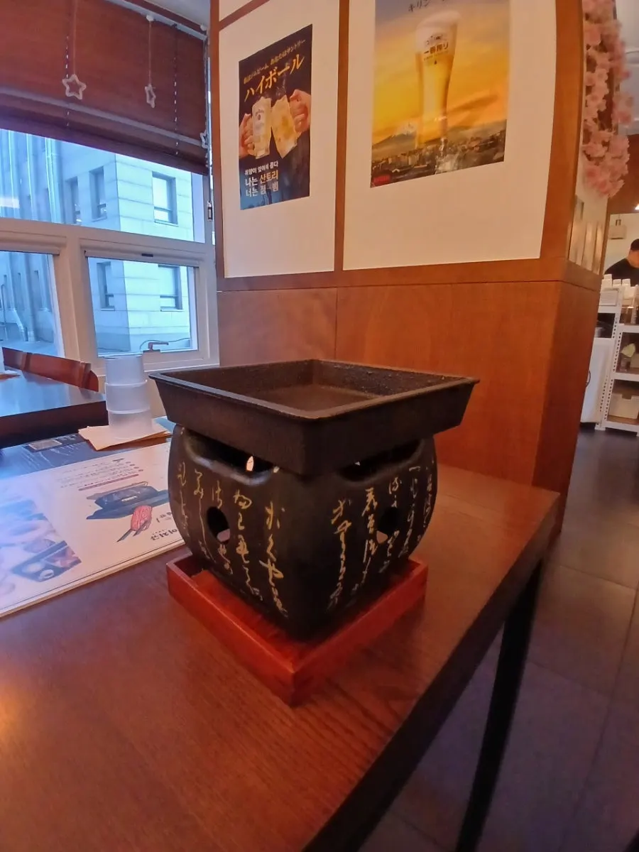 Mini solid-fuel grill on the table